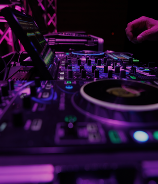 A DJ from PowerplayDJ provides live music for a Fargo event